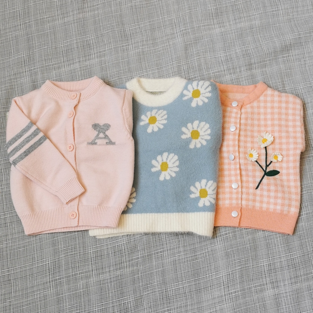 Three sweaters for baby girl